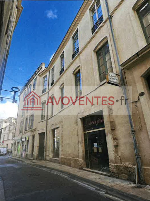 Un LOCAL à usage commercial et cave à NIMES — vente aux enchères judiciaires